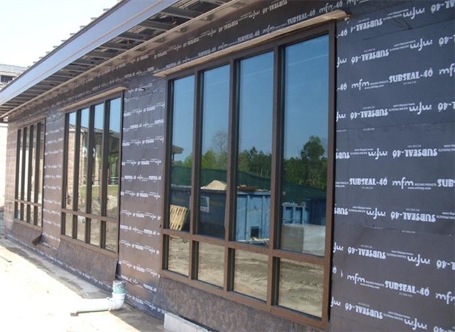 PPeel and Stick Waterproofing Membrane On Side of Commercial Building