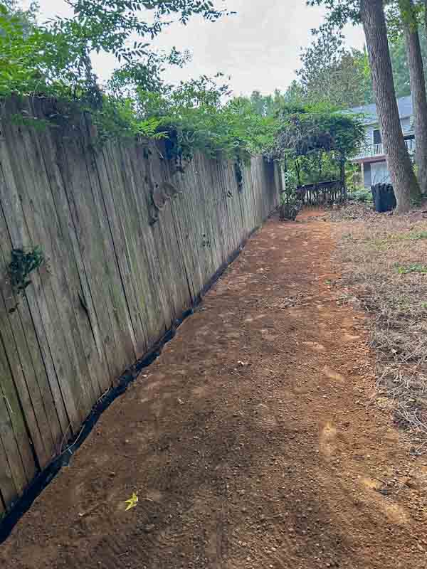 Under Fence Weed Barrier
