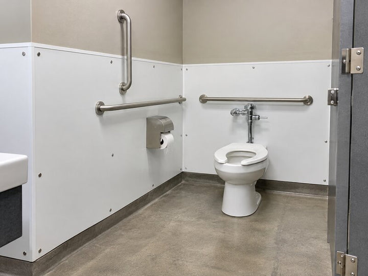White bathroom wall panels installed in an ADA-accessible restroom stall with grab bars
