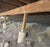 Galvanized wire mesh burrowing rodent fence in a crawl space
