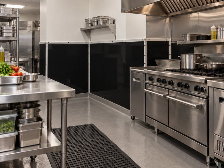 Black FRP wall panels installed near a commercial cookline range and hood
