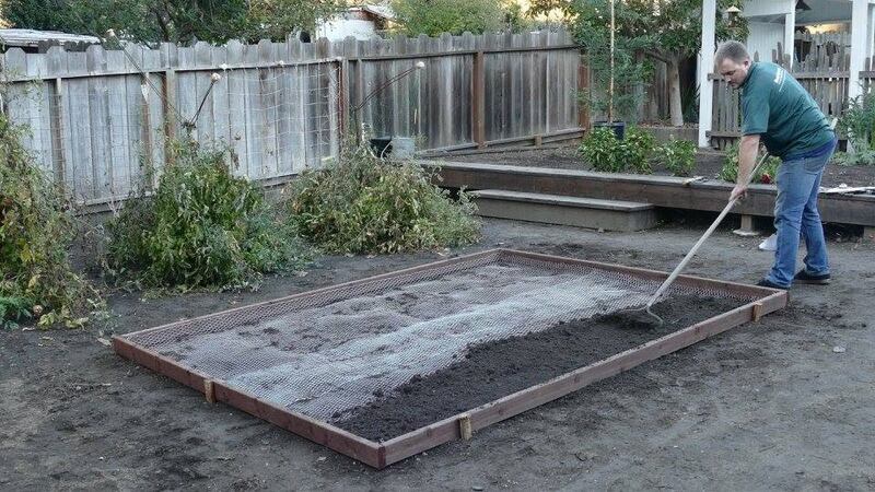 spreading dirt over gopher wire