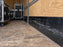 Road cases stored in a cargo trailer with HDPE wall liner protecting the lower walls
