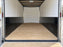 Enclosed cargo trailer interior with black HDPE wall liner installed on the lower walls
