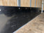 Close-up of a scratch-resistant black HDPE trailer wall liner panel riveted to plywood
