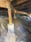 Rodent exclusion mesh wrapped around crawl space pier footings
