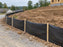 Silt fence lining a gravel road at a home construction site in a new subdivision
