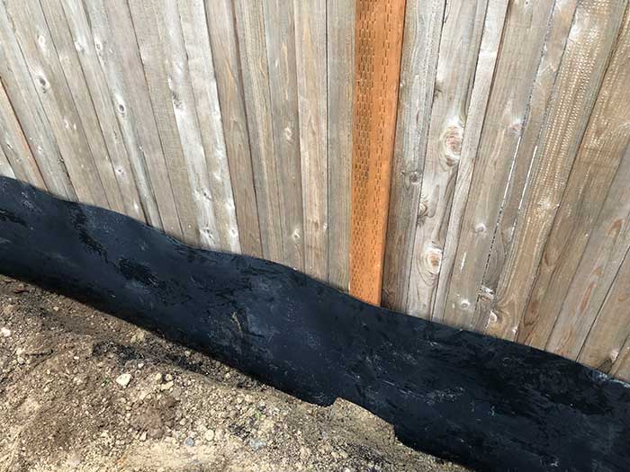 Under Fence Weed Barrier