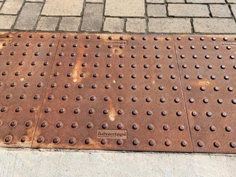 Cast Iron detectable warning system mats with patina