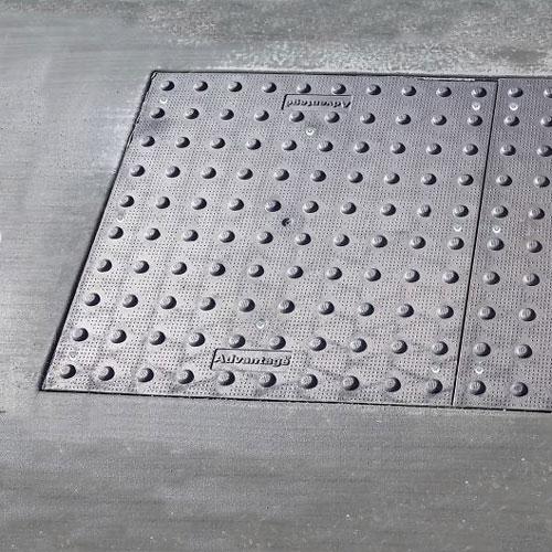 Cast Iron Tactile Warning plate set in sidewalk concrete