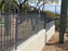 Snake fencing installed on a tiered metal fence